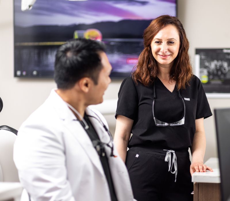 Woman smiling while receiving a tablet.