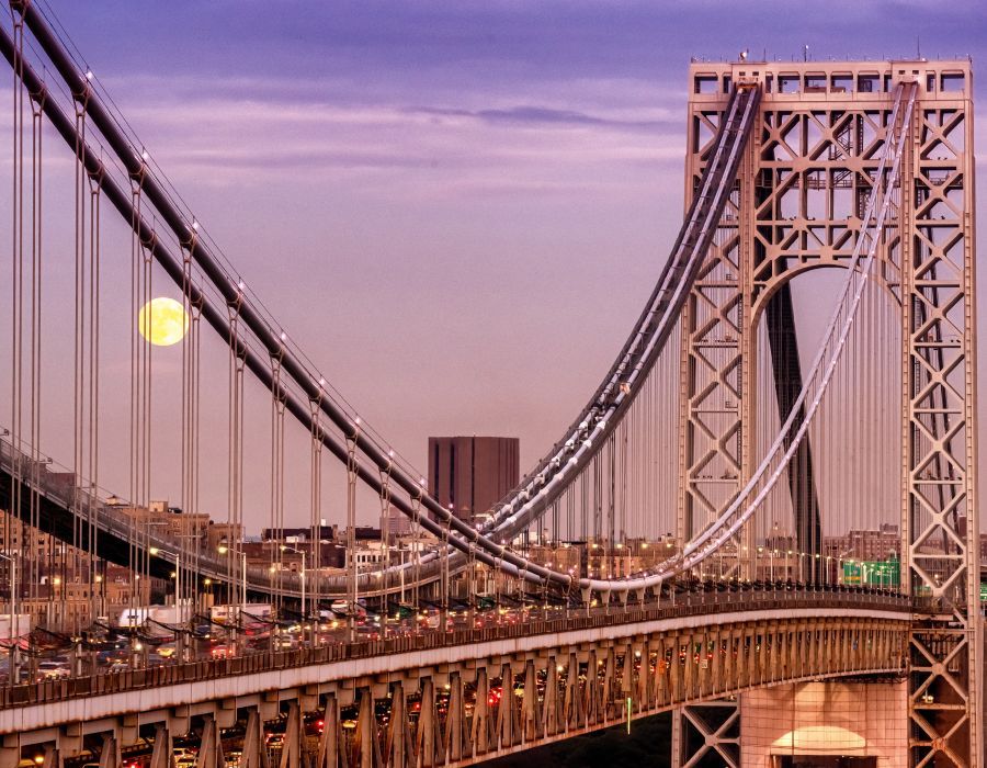 George Washington Bridge with rising full moon.