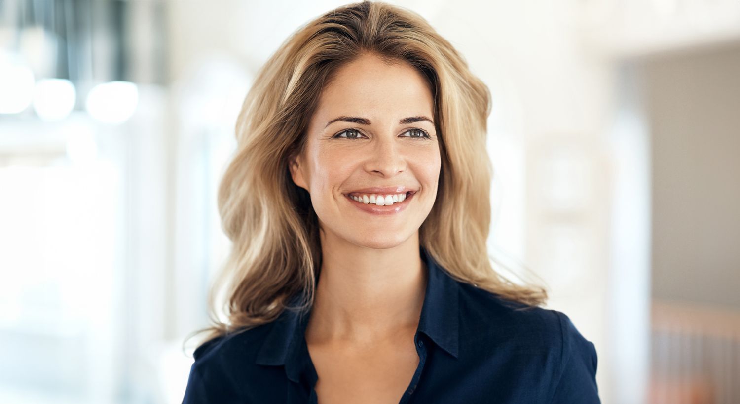 Smiling woman in a casual setting.