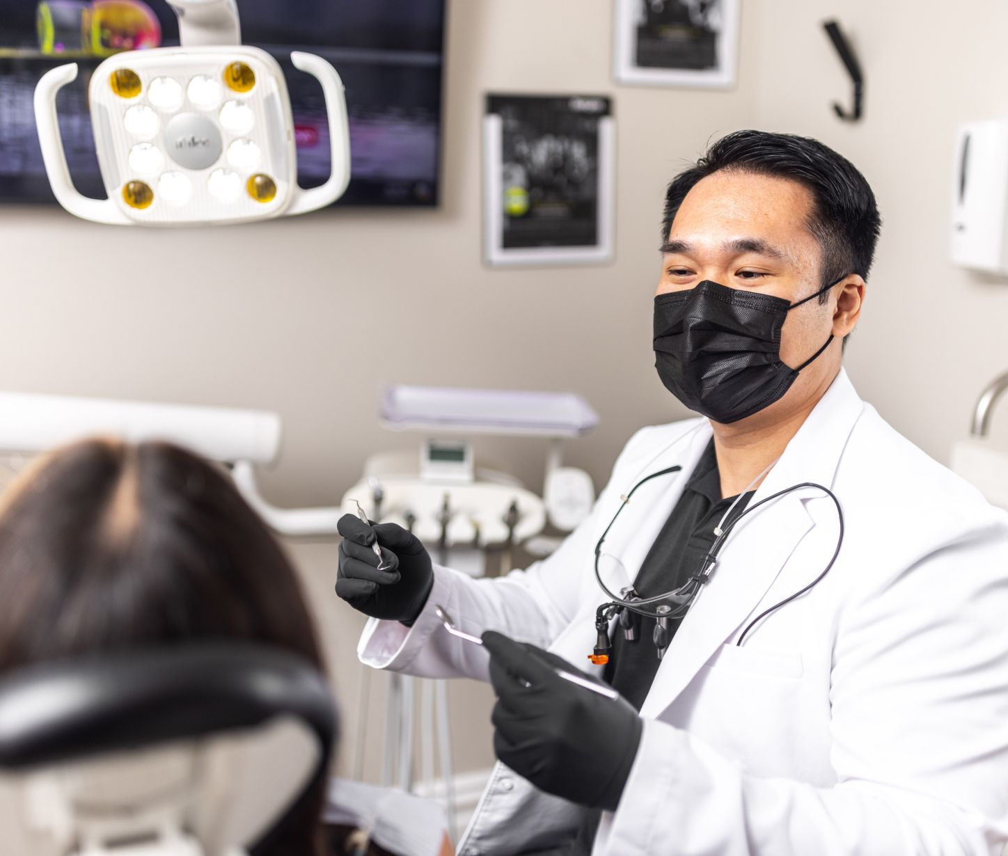 Dentist consulting with patient in office setting.